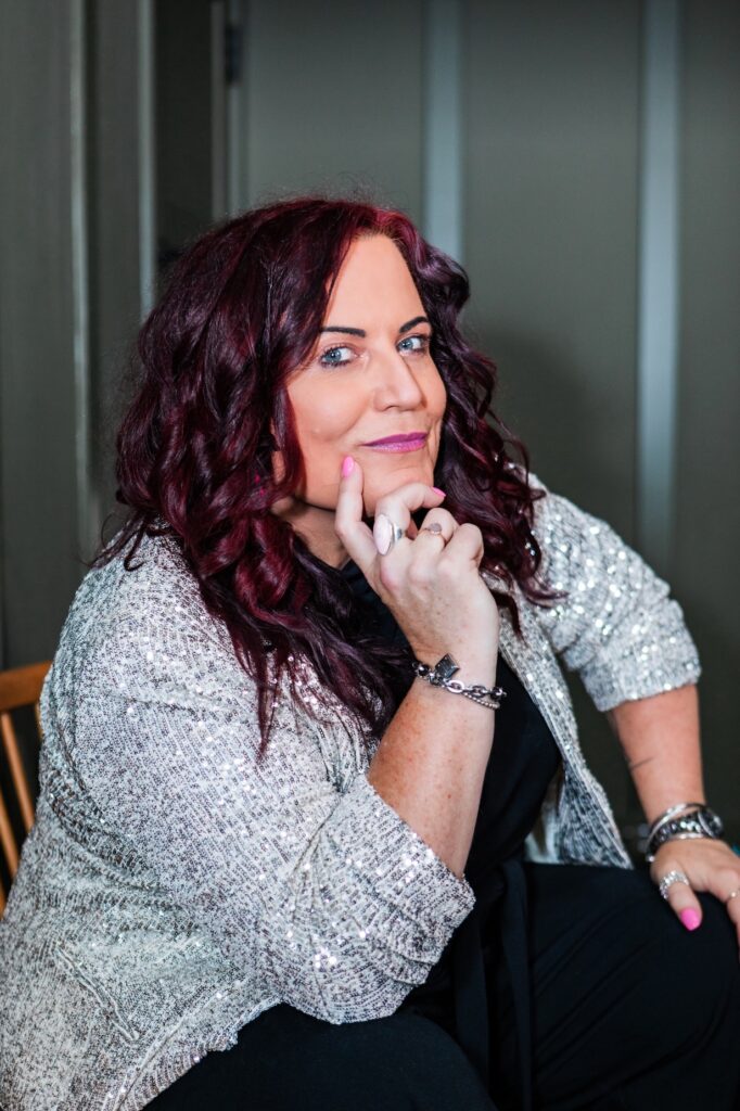 Sarah Elizabeth, Identity Designer and host of The Reinvention Era, discussing how identity can put a ceiling on business growth.